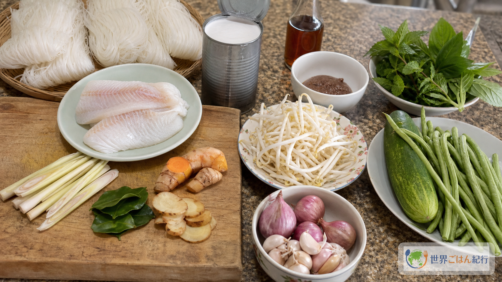 ノムバンチョックに使う米麺、白身魚、ココナッツミルク、レモングラス、ガランガル、こぶみかんの葉、野菜を台所に並べたところ